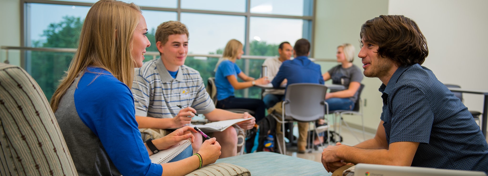 Students talking in a study room.